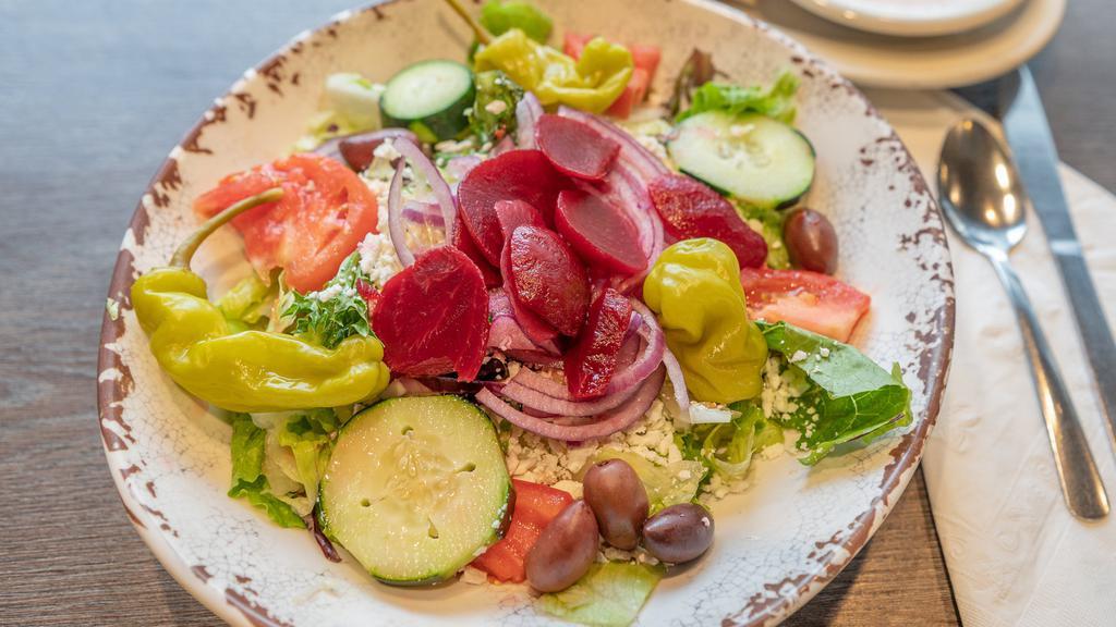 Greek Salad · Tomatoes, cucumbers, olives, beets, red onions, pepperoncini, Feta cheese. Add Chicken or Gyro Meat with an additional charge.