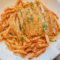 Pasta Mario · Penne pasta, tomato basil sauce, Julian strips of chicken Siciliano.