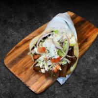 Gyro No Side · Choice of lamb or chicken topped with lettuce, diced tomatoes, onions, tzatziki sauce, and c...