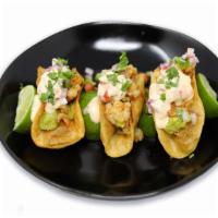Shrimp Tacos · Three shrimp tacos poached in lemongrass butter and topped with Sardi’s guacamole and chalac...