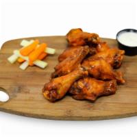 Wings · A pound of wings served naked or tossed in your choice of our house made sauces: Buffalo, BB...