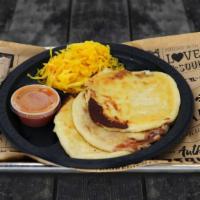 Pupusas · Grilled stuffed masa cakes. Served with spicy slaw (curtido), queso (cheese), frijol (bean +...