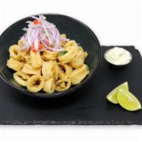 Calamari · Fresh squid marinated and deep fried. Served with yucca and sarza criolla.