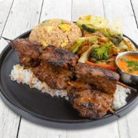 Steak  Anticuchos  · Steak skewers marinated and charbroiled to perfection. Served with choice of 2 sides.