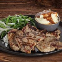 Pork Chops · Three fresh Berkshire center-cut pork chops house marinated and char-grilled to seal in flav...