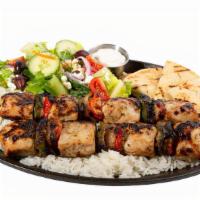 Souvlaki · Medallions of chicken tenderloin, peppers, and onions on a skewer, pita bread and tzatziki s...