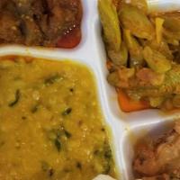 South Indian Vegetarian Thali · Served with a side, rice, dal pappu, two vegetable curries, pickles, papad, rasam and curd. ...
