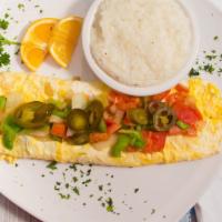 Spanish Omelet · Picante sauce, jalapeños, bell pepper, onions, tomatoes, and sour cream.