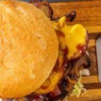 Bacon Cheddar Burger · Thick cut pepper bacon, Cheddar cheese. All burgers served on a brioche bun with shredded le...