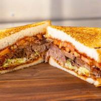 Kalbi Brisket Sandwich · Thin sliced Kalbi brisket, union hall BBQ sauce, shredded lettuce on Texas toast. All sandwi...