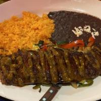 Churrasco Steak · Skin steak marinated on homemade chimichurri sauce. Served over grilled veggies, rice and be...