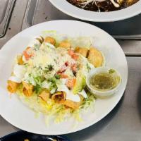 Flautas · 5 deep-fried corn tortillas stuffed with chicken, topped with shredded lettuce, sour cream, ...