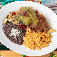 Carne Asada · Grilled marinated ribeye steak served with grilled veggies, nopal, rice and beans.