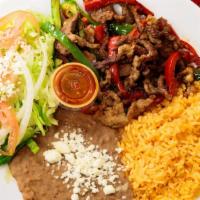 Fajitas De Res · 1 pound Fresh Fajitas smothered in onion, bell pepper and tomatoes with a side of rice and b...