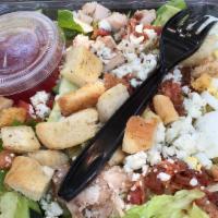 1/2 Cobb Salad · Romaine lettuce, chicken, bacon, blue cheese, egg, tomato, cucumber, home made croutons and ...