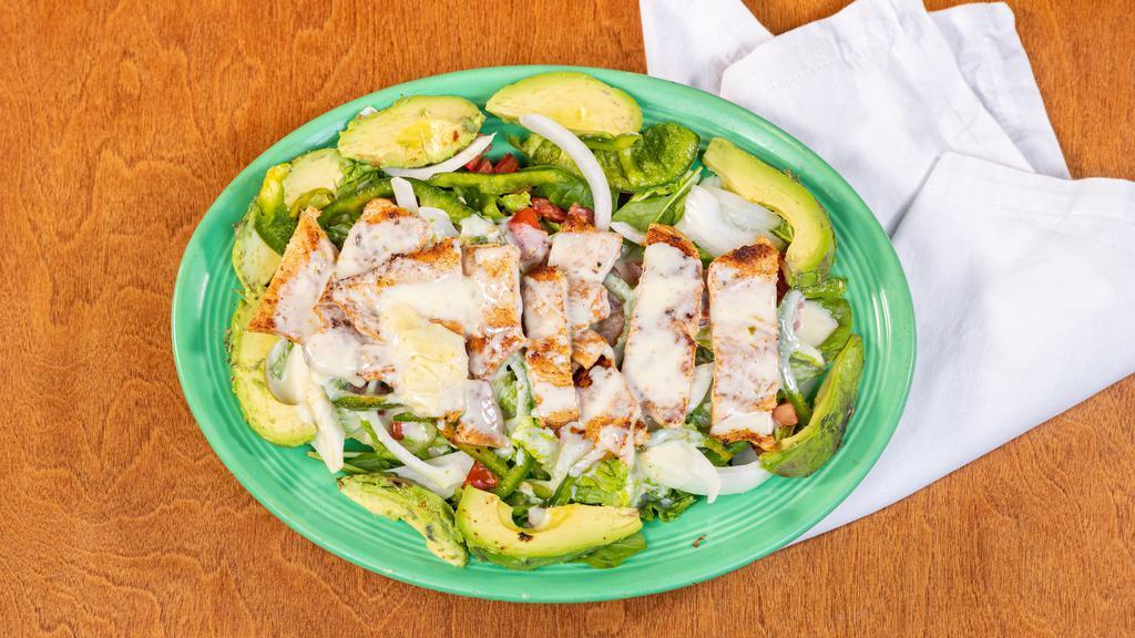 Avocado Chicken Salad · Chicken, lettuce, tomato, onions, bell peppers avocado and white cheese on top.