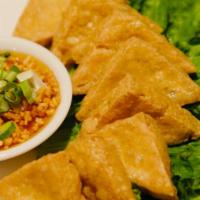 Tofu Tod · 16 pieces. Deep fried bean curd. Served with plum sauce. Topped with ground peanut.