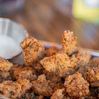 Popcorn Chicken · Our popcorn chicken marinades for 24 hours in a louisiana style buttermilk brine. Fried to c...