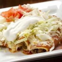 Enchiladas Supreme · One chicken, one bean, one cheese, one beef enchilada covered in our enchilada ranchero sauc...