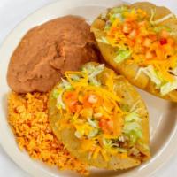 Puffy Taco Plate · Two puffy tacos (choice of beef, chicken, bean, or guacamole), rice, beans, and two corn tor...