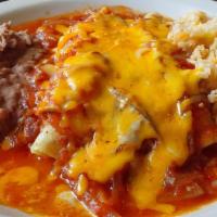 Red Chicken Enchiladas · Two chicken enchiladas topped with our red tomato and onion sauce and cheese, served with ri...