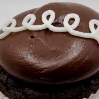Better Than A Hostess · A chocolate cupcake filled with a vanilla buttercream topped with a fudge icing and vanilla ...