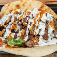 Lamb Wrap · Lamb marinated with Box'd seasoning, served on Box'd flatbread with with arugula, green and ...