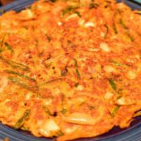 Kimchi Pancake · Kimchi and scallions, served with pancake dipping sauce.