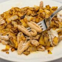 Karpathian Makarounes · Whole- wheat Cavatelli topped with sauteed onions and traditional cheese