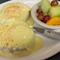Traditional Eggs Benedict · Smoked ham steak with two eggs on toasted English muffin topped with homemade hollandaise sa...