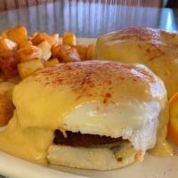 Crab Cake Eggs Benedict · Crab cakes fried until golden brown with two eggs on toasted English muffin and homemade hol...
