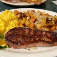 Breakfast Steak · Grilled choice steak lightly seasoned with two eggs and home fries, toast or biscuit