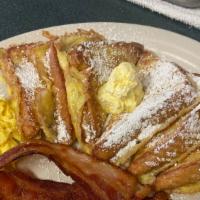 French Toast Combo · Three slices of our special french toast dipped in fluffy egg batter and served with choice ...