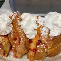 Stuffed French Toast · Three slices of our special french toast stuffed with cream cheese and strawberries topped w...