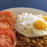 Corned Beef Hash · A generous portion of our corned beef hash topped with three eggs, home-fried potatoes and b...