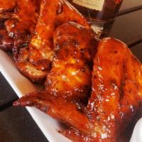 Woodfire Buffalo Wings · six whole wings rubbed with signature herbs and spices, roasted over an open flame and brush...