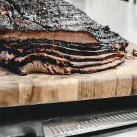 Beef Brisket - Family (By The Pound) · marinated and slow-smoked, served with a side of savory BBQ sauce. Order by 1/2 or 1 lb (sid...