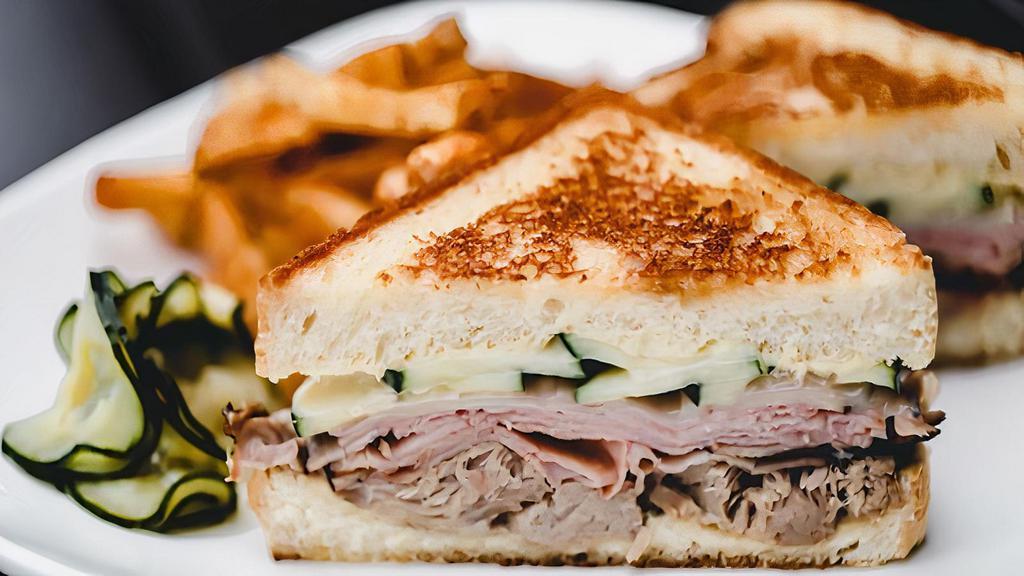 Cubano · house smoked pulled pork, black forest ham, house pickles, swiss, dijon aioli, grilled texas toast. served with your choice of side.