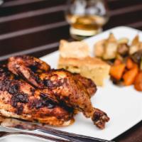 Rotisserie Chicken · half chicken, dry rubbed, slow roasted on our wood fired rotisserie. Served with cornbread &...