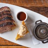 Beef Brisket · marinated and slow smoked, served with a side of savory barbecue sauce. served with cornbrea...