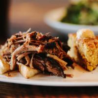 Pork Shoulder - Family (By The Pound) · duroc pork slowly roasted and smoked until tender served with our golden BBQ sauce. Order by...