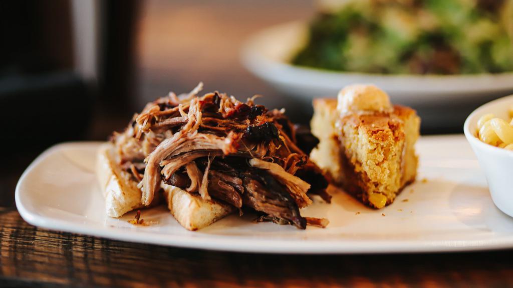 Pork Shoulder - Family (By The Pound) · duroc pork slowly roasted and smoked until tender served with our golden BBQ sauce. Order by 1/2 or 1 lb (sides sold separately). GF
