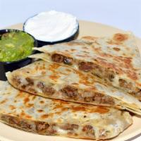 Quesadilla · Served with sour cream and guacamole.