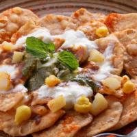 Papri Chaat · Crispy fried savory flour wafers topped with chickpeas, potatoes, yogurt sauce, spices, cila...