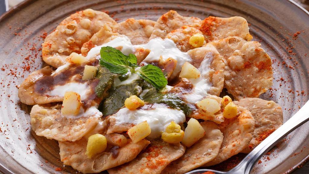 Papri Chaat · Crispy fried savory flour wafers topped with chickpeas, potatoes, yogurt sauce, spices, cilantro-mint & sweet tamarind chutneys (Vegetarian, Nut Free)