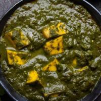 Palak Paneer · Soft Indian cottage cheese cubes that are simmered in spinach sauce cooked with spices & her...