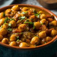 Chana Masala · Chickpeas cooked in a tomato & onion based curry with savory spices/masala & herbs (Vegetari...