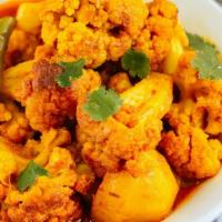 Gobi Aloo · Cauliflower & potatoes pieces stir-fried with onions, tomatoes, savory spices, & fresh herbs...