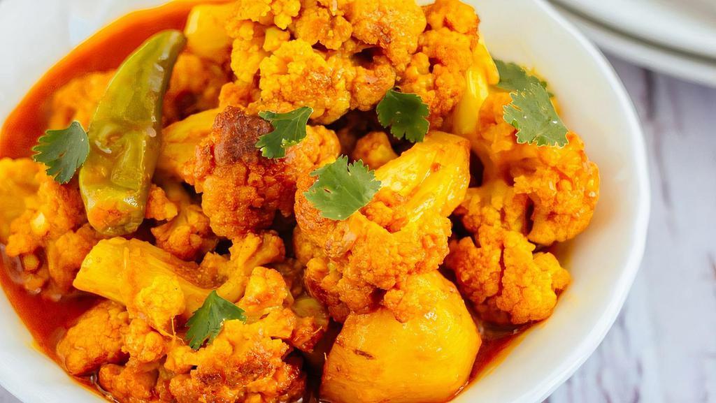 Gobi Aloo · Cauliflower & potatoes pieces stir-fried with onions, tomatoes, savory spices, & fresh herbs (Vegetarian, Vegan, Gluten-Free, Nut-Free)