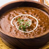 Daal Makhani · Whole black lentils that are slow cooked with red kidney beans, savory spices, butter, & cre...